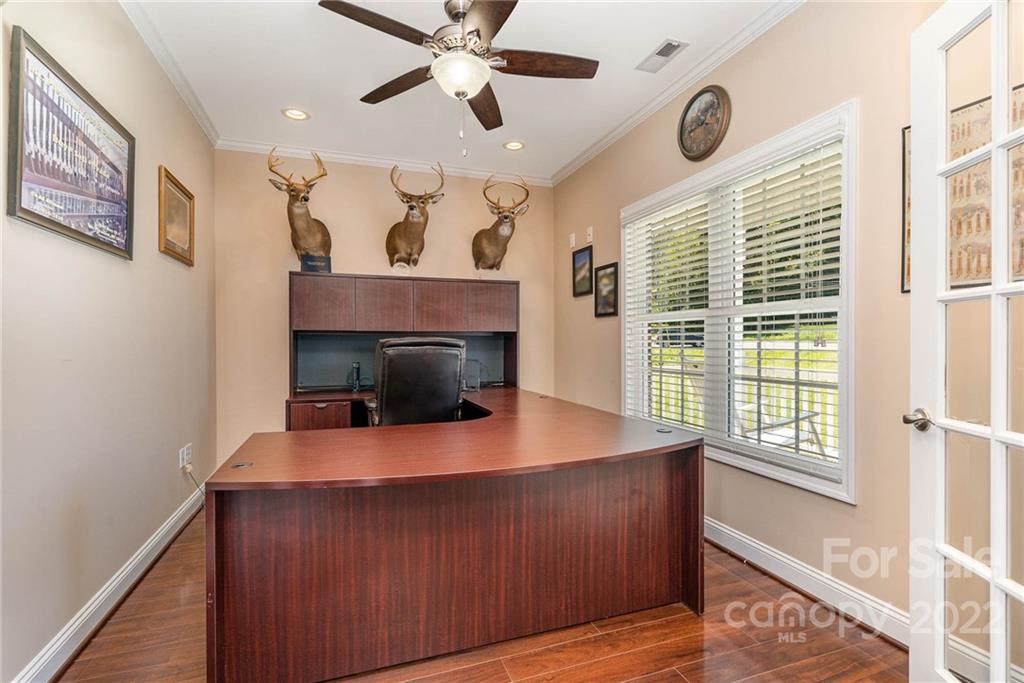 7920 Mt Olive Road Concord, NC 28025 - Photo 20 of 43 a living room with furniture and a fireplace