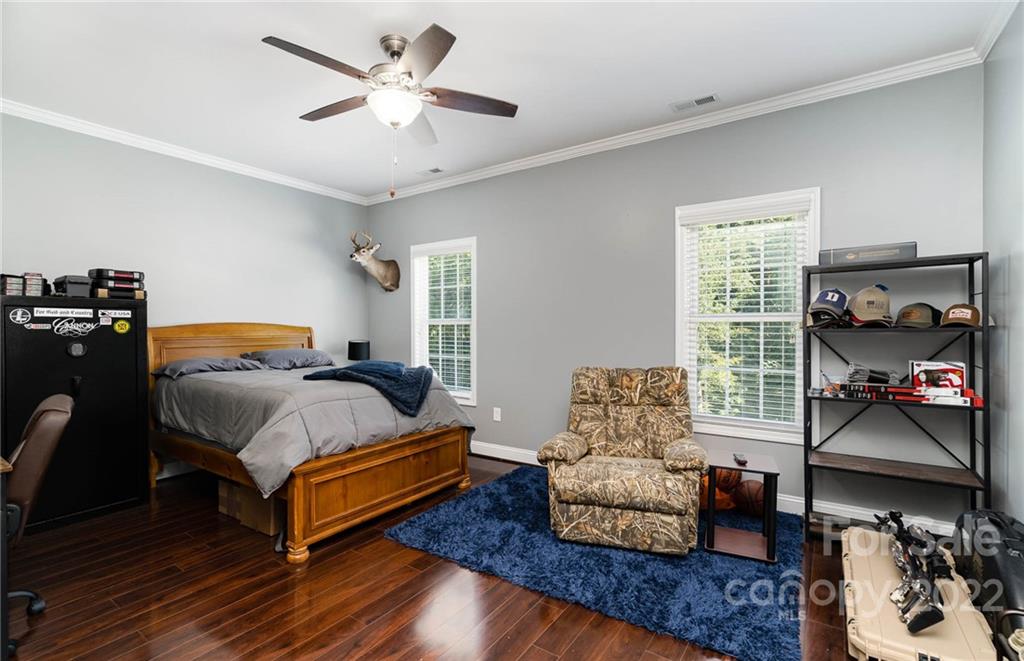 7920 Mt Olive Road Concord, NC 28025 - Photo 22 of 43 a bedroom with furniture and a couch