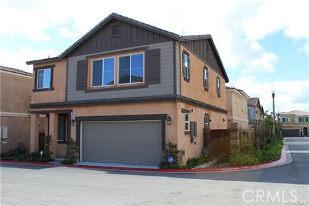 a front view of a house with garage