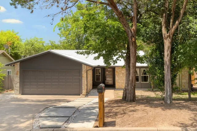 a backyard of a house with lots of green space