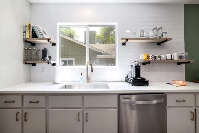 a dining room with furniture a window and a chandelier