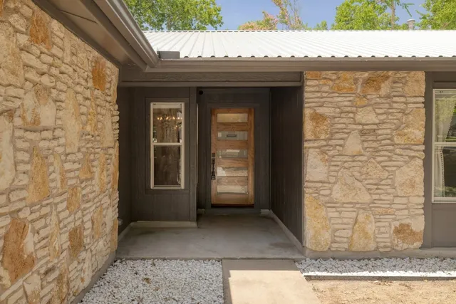 a view of a door and a window