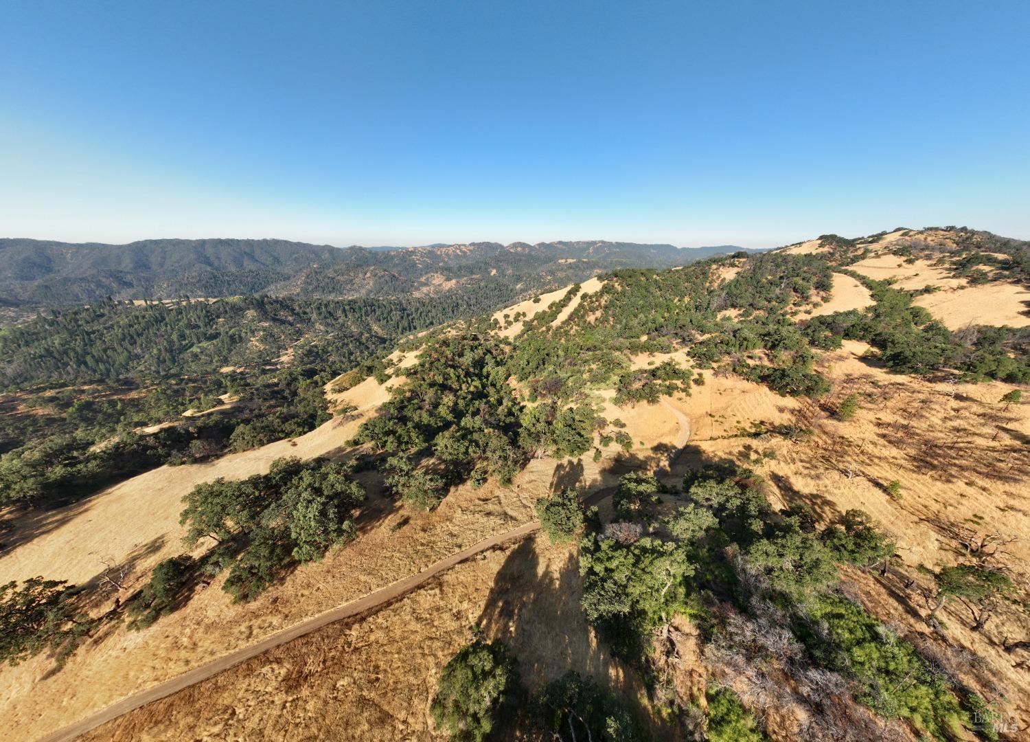 9007-9027 Stewarts Point-Skaggs Springs Road Healdsburg, CA 95448 - Photo 20 of 23 an aerial view of mountain with an ocean