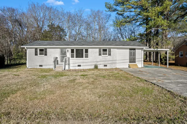 front view of a house with a yard