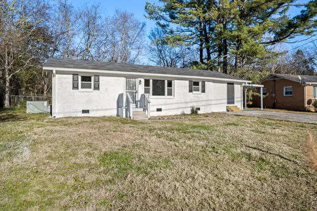 a house with yard in front of it