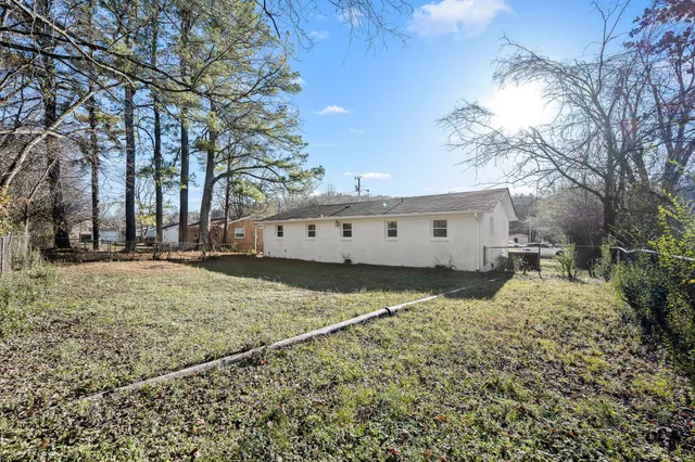 a view of a house with snow on the road