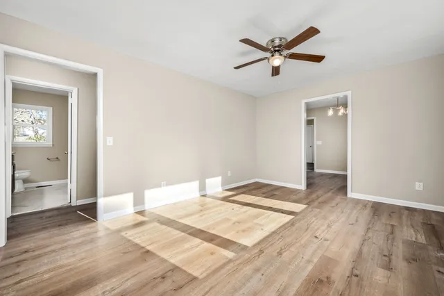 a very nice looking room with a ceiling fan