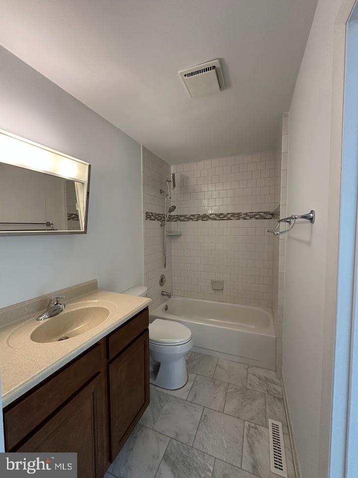 17904 Marshall Mill Road Hampstead, MD 21074 - Photo 6 of 10 a bathroom with a sink a toilet and shower