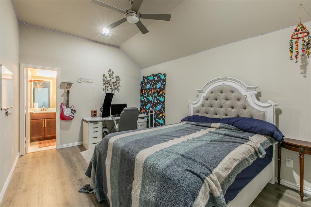 2521 Maidenhair Road Frisco, TX 75033 - Photo 23 of 39 Vaulted ceiling room with wood-finish flooring