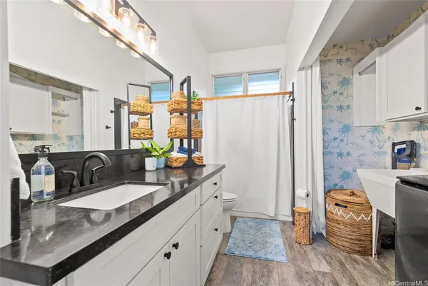 a bed room with a bed and a chair