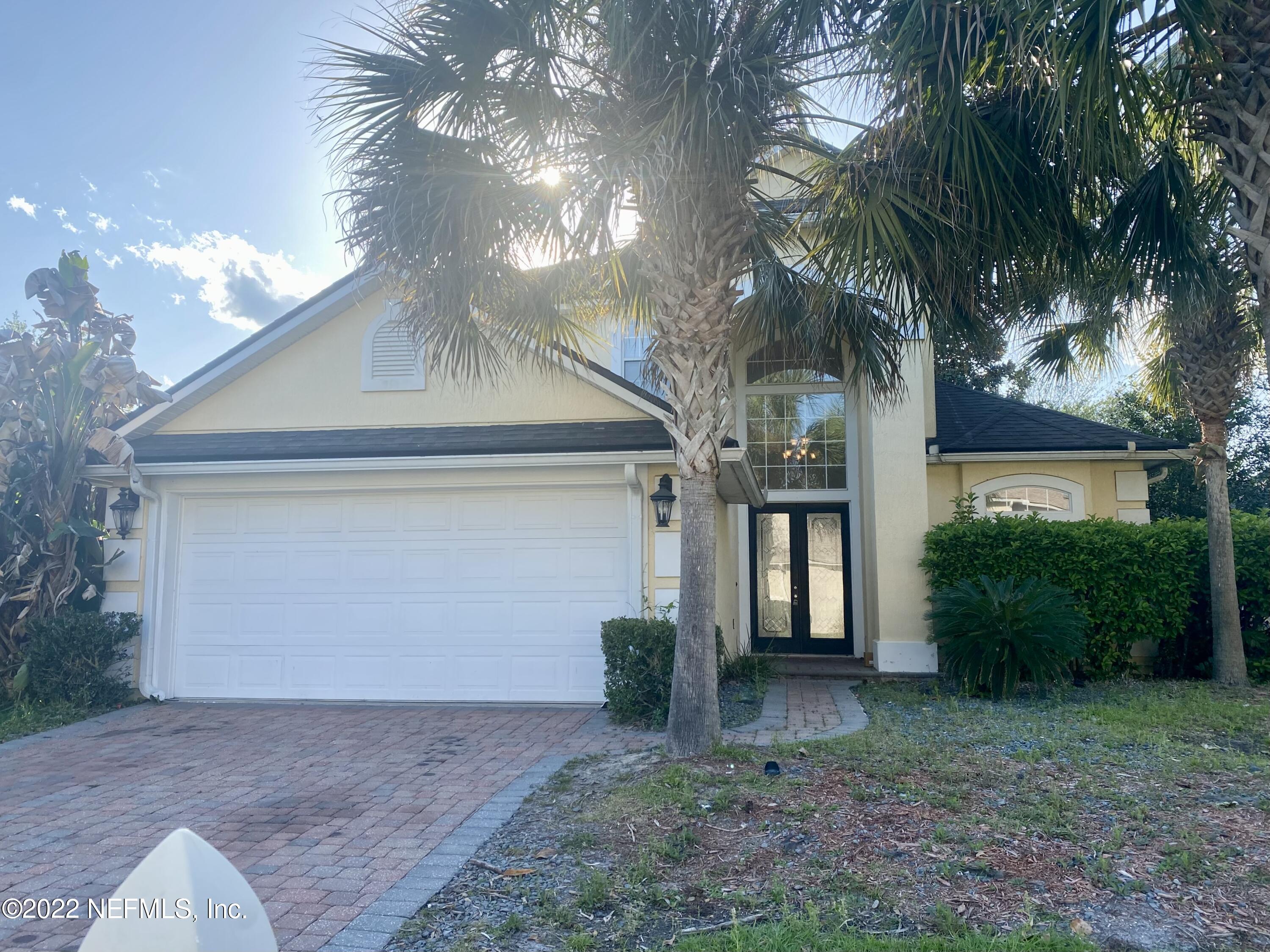 1648 Summerdown Way St. Johns, FL 32259 - Photo 1 of 14 a view of a house with a yard and garage