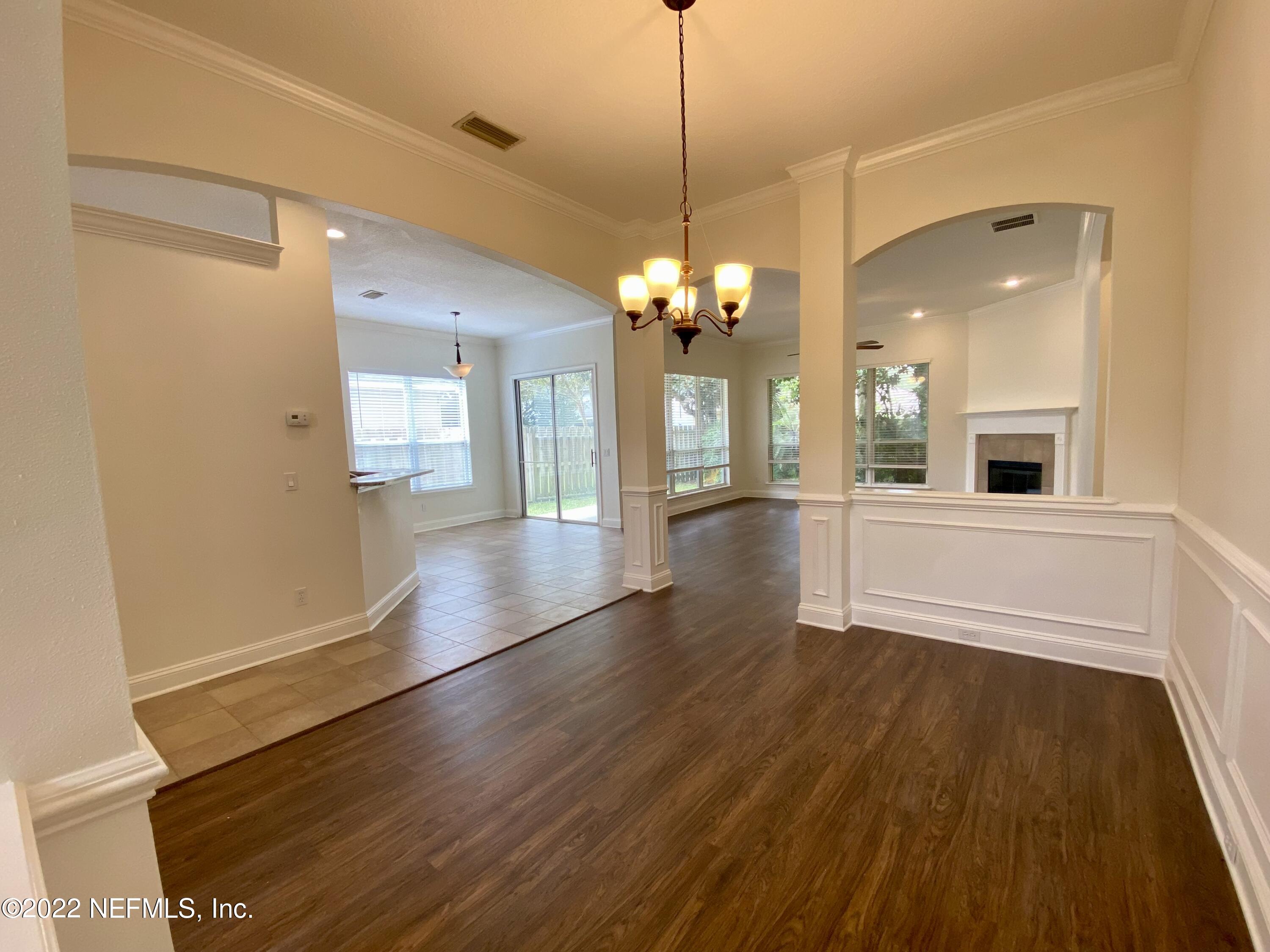 1648 Summerdown Way St. Johns, FL 32259 - Photo 3 of 14 a view of a big room with wooden floor and staircase
