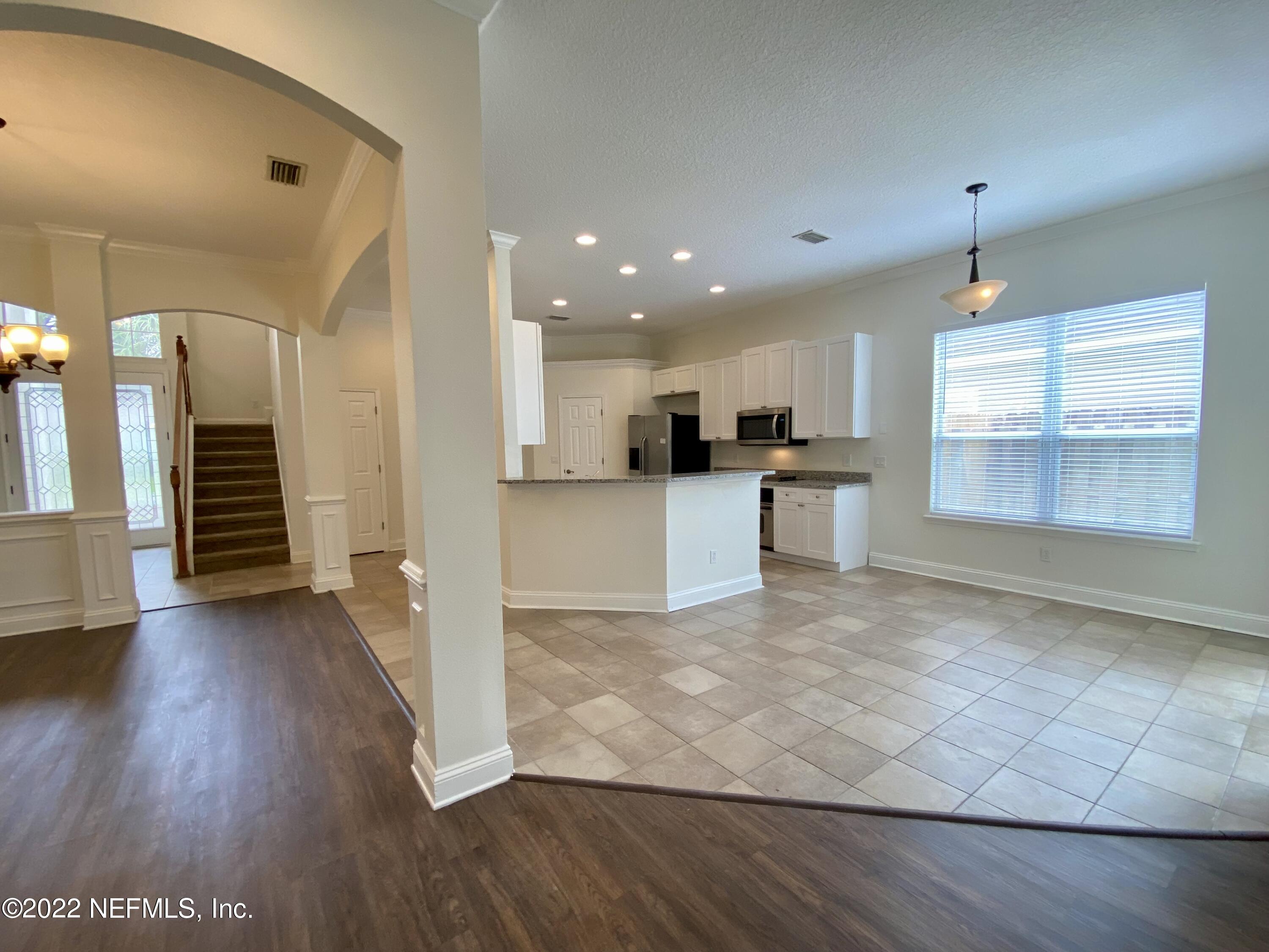 1648 Summerdown Way St. Johns, FL 32259 - Photo 6 of 14 a view of kitchen with cabinets and wooden floor