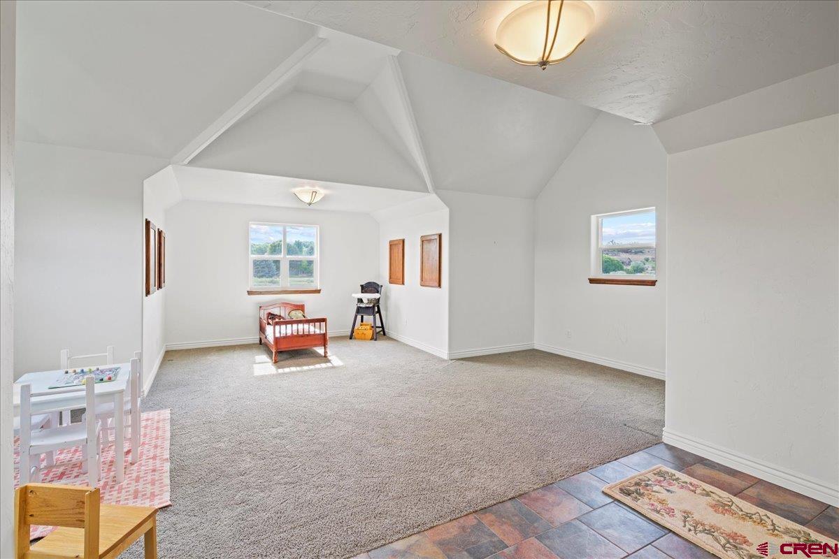 13902 5950th Road Montrose, CO 81403 - Photo 25 of 35 a living room with furniture and a window