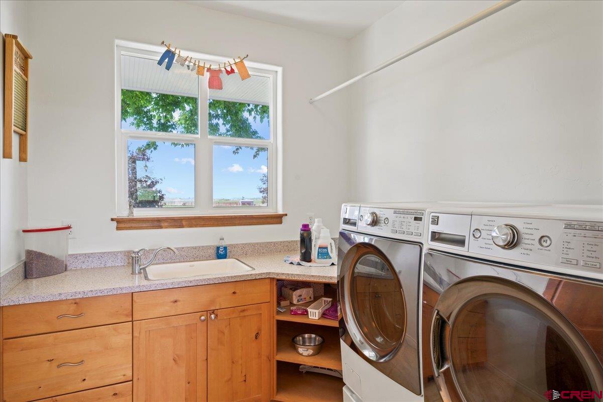 13902 5950th Road Montrose, CO 81403 - Photo 28 of 35 a utility room with dryer and washer