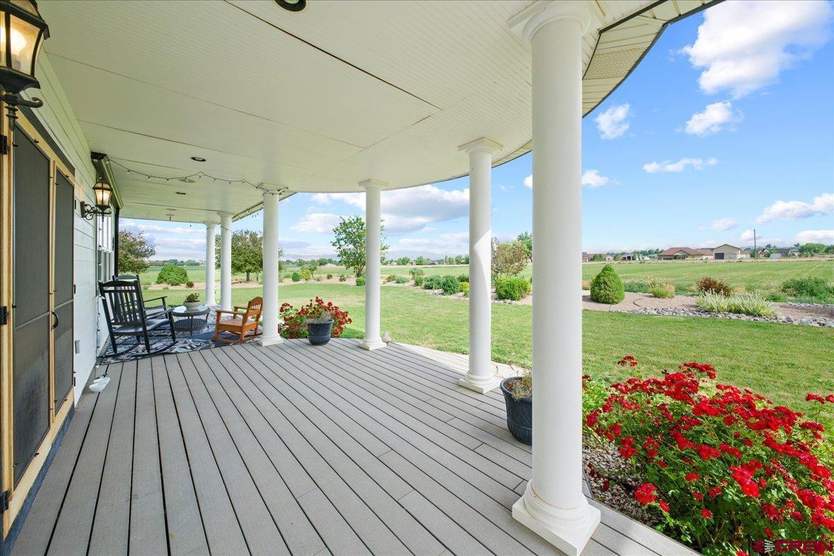 13902 5950th Road Montrose, CO 81403 - Photo 30 of 35 a view of a porch with wooden floor