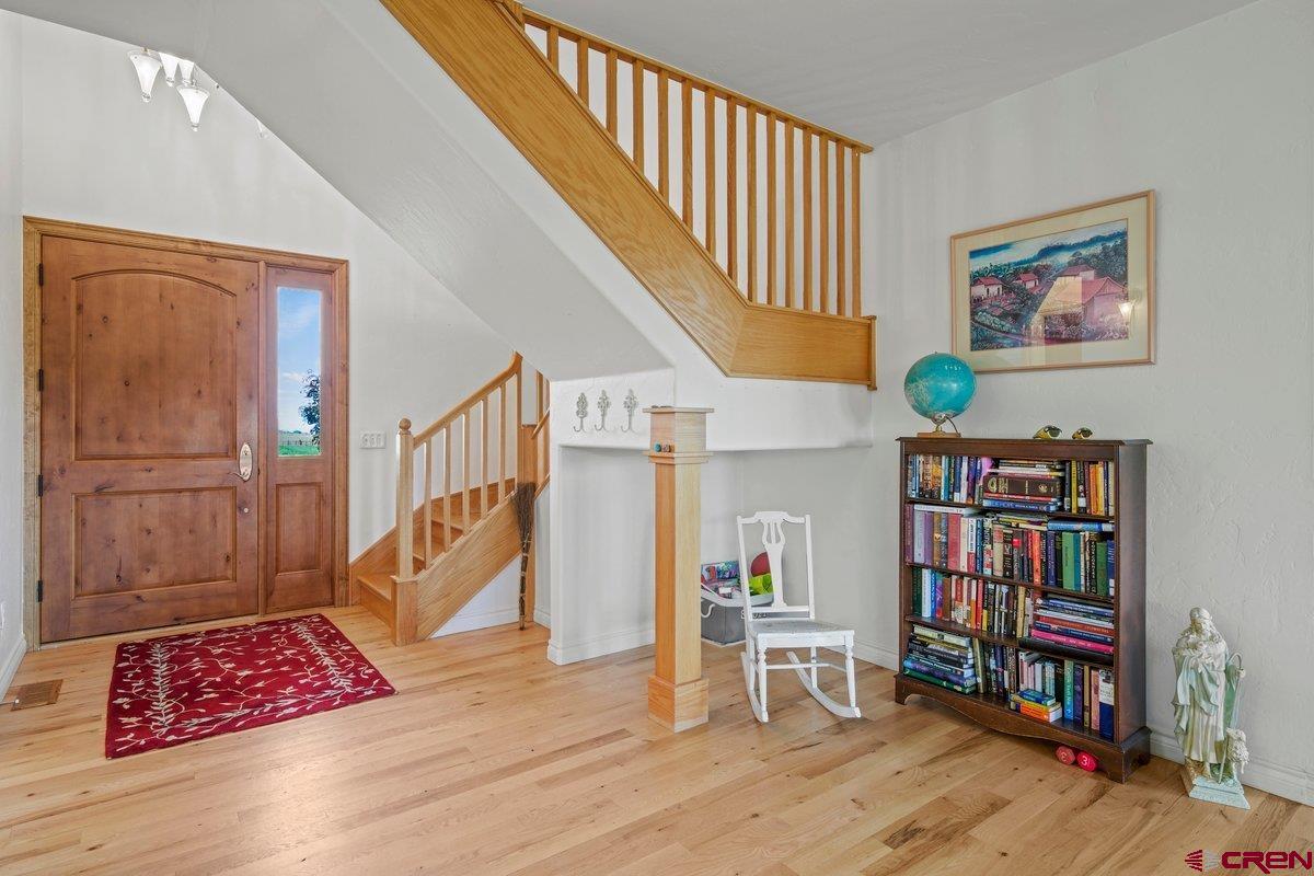 13902 5950th Road Montrose, CO 81403 - Photo 3 of 35 a view of room with furniture and wooden floor