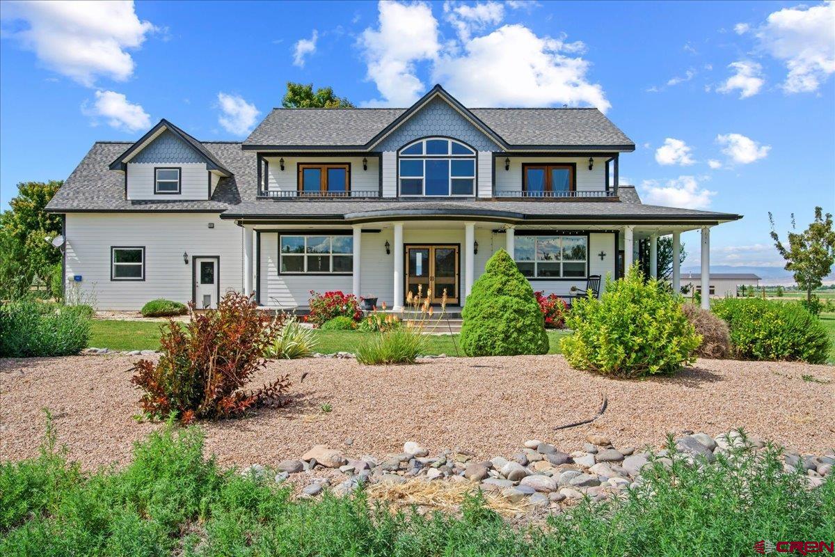 13902 5950th Road Montrose, CO 81403 - Photo 33 of 35 front view of a house with a garden