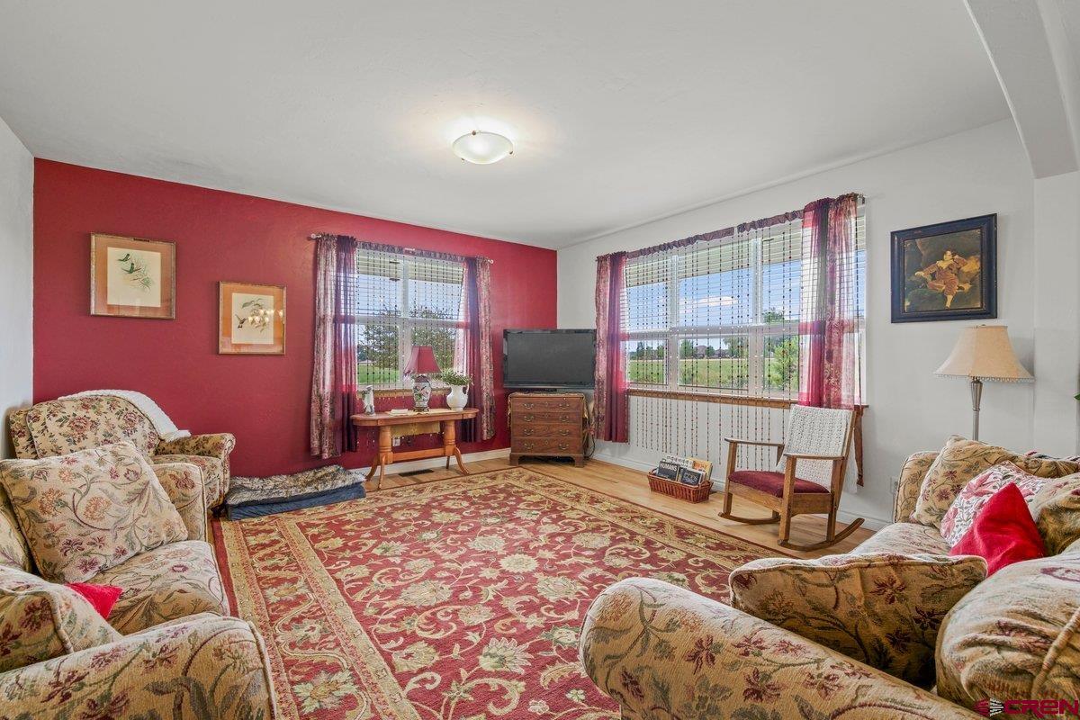 13902 5950th Road Montrose, CO 81403 - Photo 5 of 35 a living room with furniture and a window