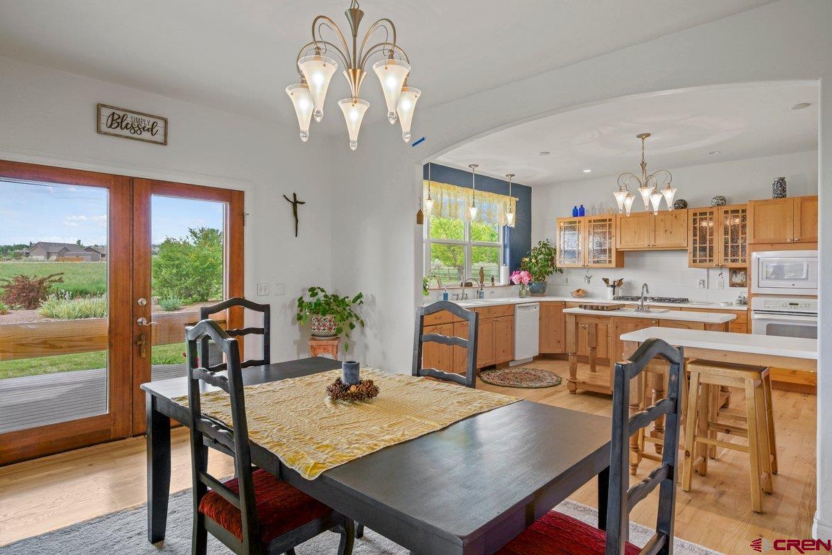 13902 5950th Road Montrose, CO 81403 - Photo 6 of 35 a view of a dining room with furniture window and outside view