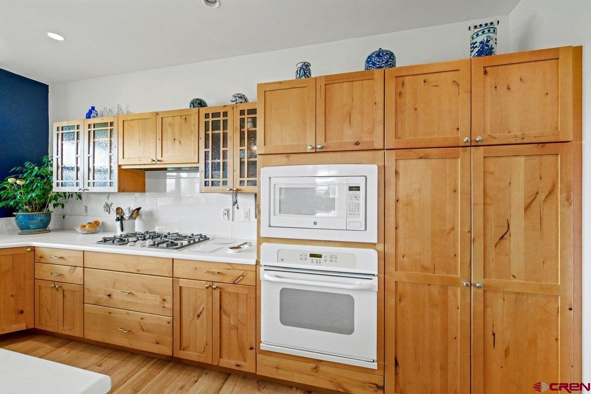 13902 5950th Road Montrose, CO 81403 - Photo 8 of 35 a kitchen with stainless steel appliances white cabinets and a sink
