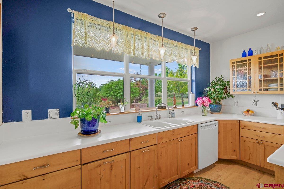 13902 5950th Road Montrose, CO 81403 - Photo 9 of 35 a kitchen with a large window and sink