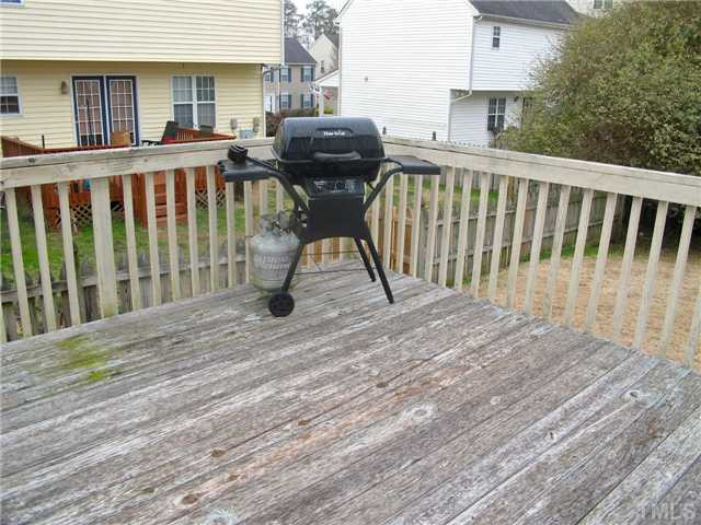 2300 Turtle Point Drive Raleigh, NC 27604 - Photo 24 of 25 Imagine spending a great afternoon grilling on your large deck. The exteriors are partially maintained by the HOA and power washing for this section is scheduled soon. Patio/Deck