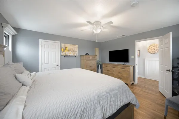 a spacious bathroom with a sink a large mirror and a shower