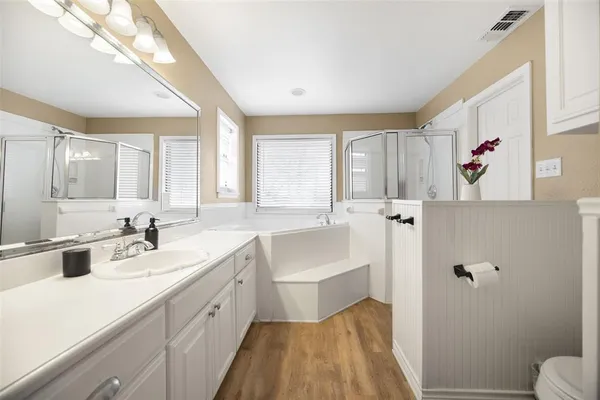 a white bath tub sitting next to a window