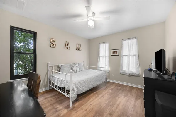 a bathroom with a sink vanity and a mirror