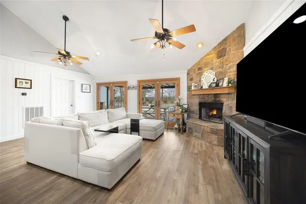 a kitchen with a sink appliances and cabinets