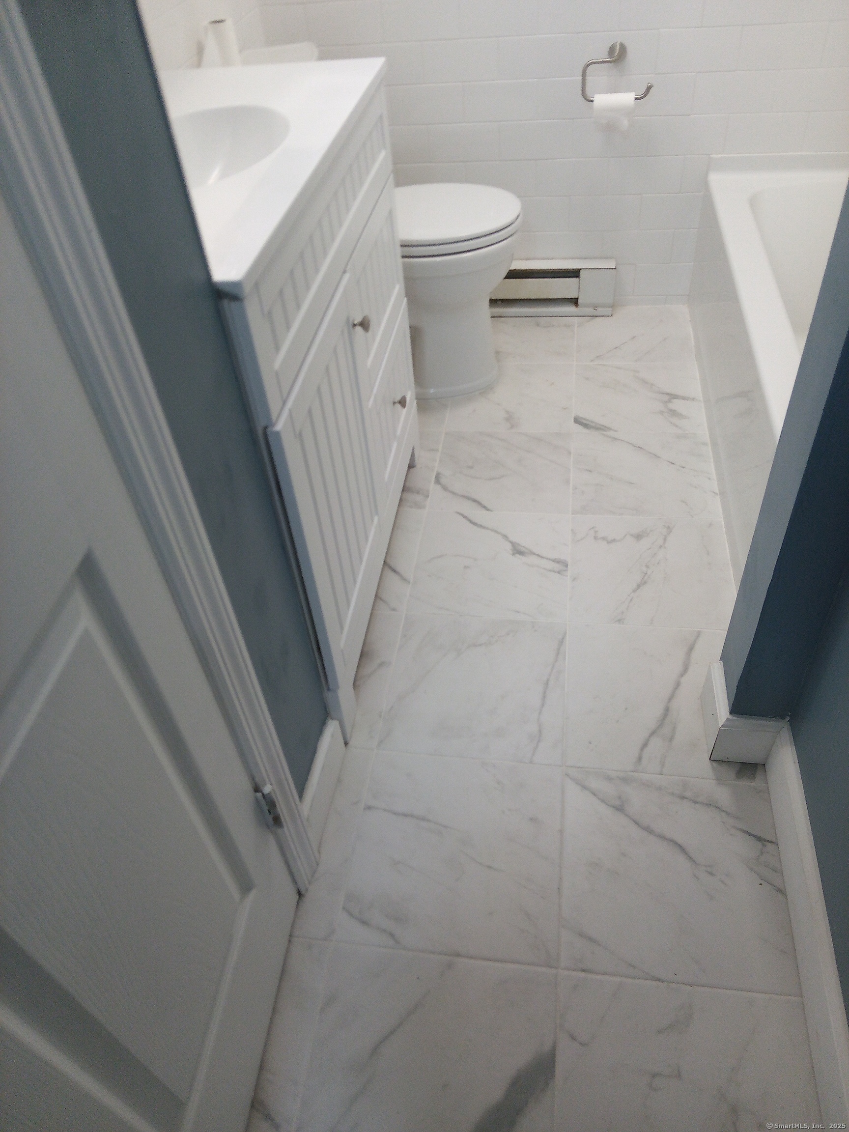 74 Washington Road, Unit 16 Woodbury, CT 06798 - Photo 21 of 25 a bathroom with a sink and toilet