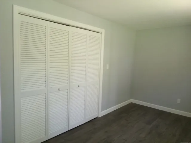 a view of a chairs and table in backyard