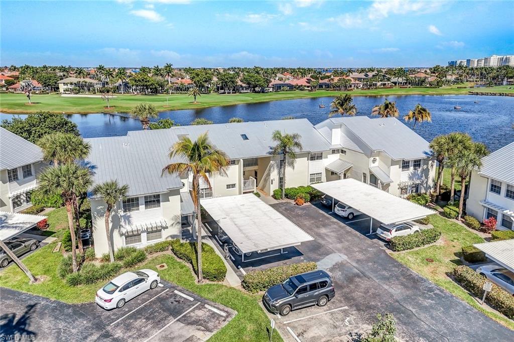 14985 Rivers Edge Court, Unit 236 Fort Myers, FL 33908 - Photo 2 of 33 an aerial view of a house with a lake view