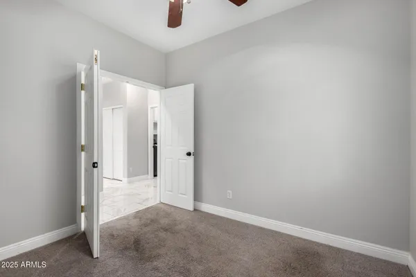 an empty room with a bathroom