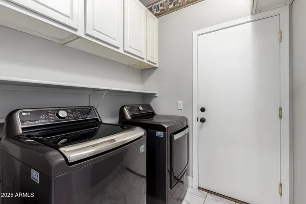 a stove top oven sitting inside of a kitchen