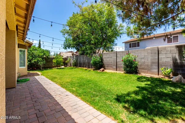 a view of a yard with brick house
