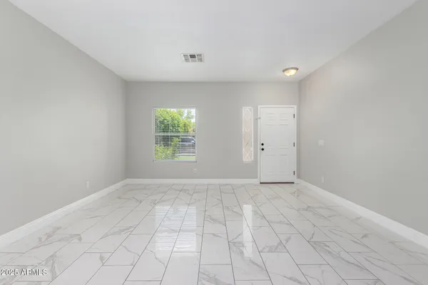 a view of an empty room with a window