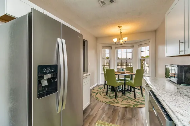 a view of a dining room with furniture window and outside view
