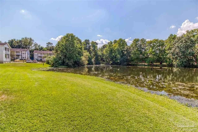 a view of a lake with a big yard