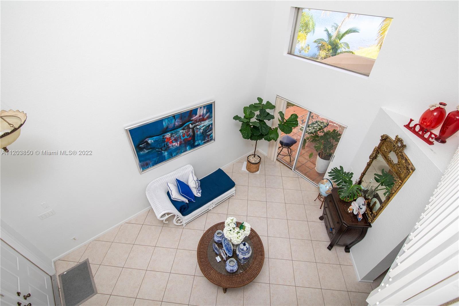 14821 Southwest 20th Street Miramar, FL 33027 - Photo 4 of 50 a vase of flowers sitting on a floor