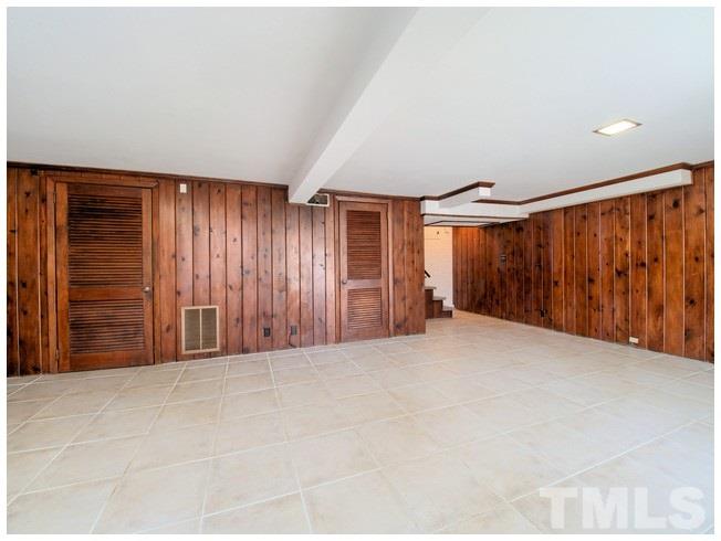 3309 Leonard Street Raleigh, NC 27607 - Photo 13 of 21 a view of an empty room with wooden floor