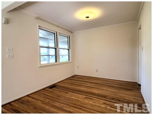 3309 Leonard Street Raleigh, NC 27607 - Photo 4 of 21 an empty room with windows