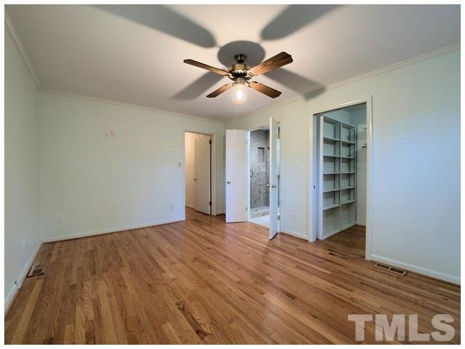 3309 Leonard Street Raleigh, NC 27607 - Photo 8 of 21 a view of empty room with wooden floor and fan
