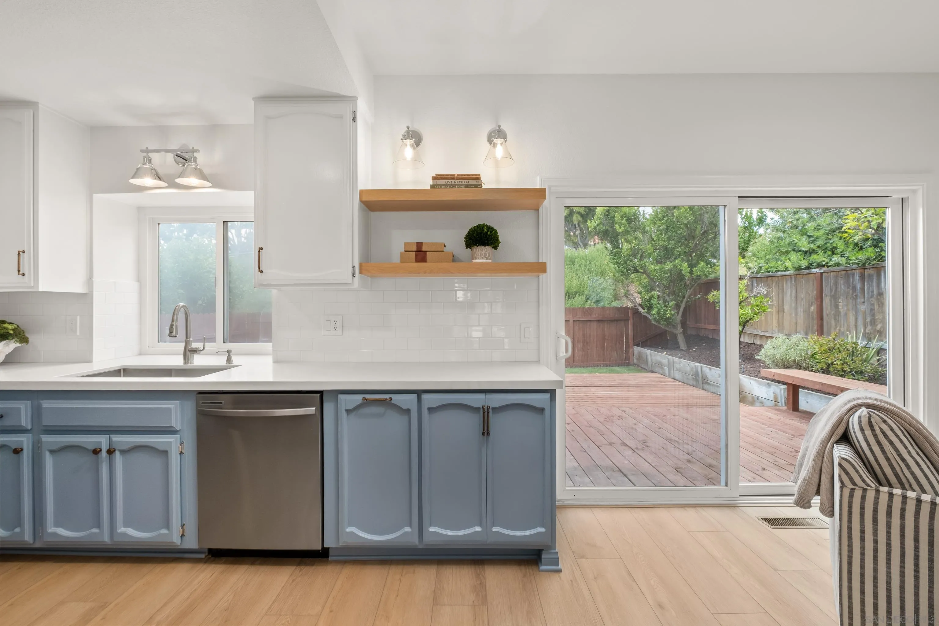 11478 Madera Rosa Way San Diego, CA 92124 - Photo 16 of 54 a view of a kitchen with a sink and a large window