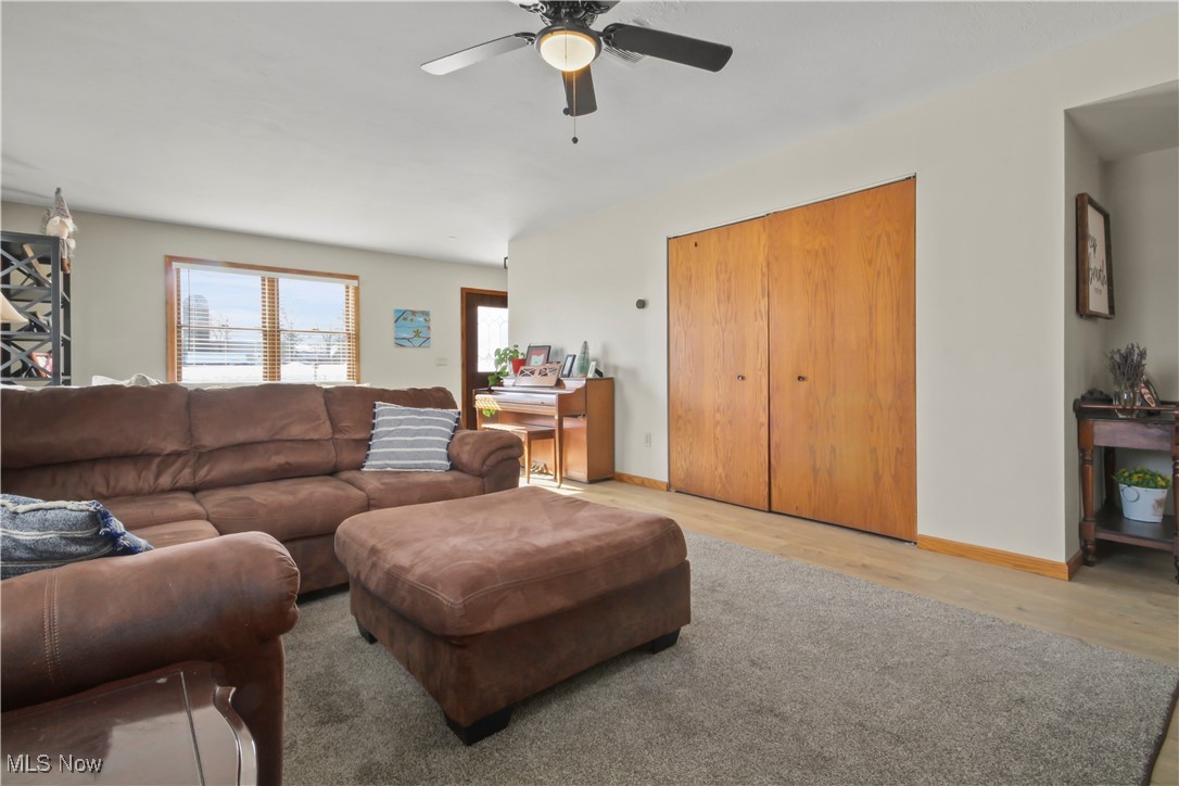 28196 Hartley Road Beloit, OH 44609 - Photo 10 of 27 Living room featuring light wood finished floors and ceiling fan
