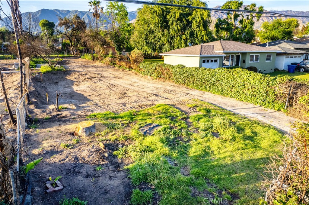 169 West Woodbury Road Altadena, CA 91001 - Photo 4 of 8 a view of a house with a yard