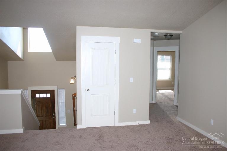 63201 Northeast Boyd Acres Road Bend, OR 97701 - Photo 7 of 14 a view of an empty room with bathroom and a window
