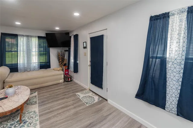 a view of a dining table and chairs in a room