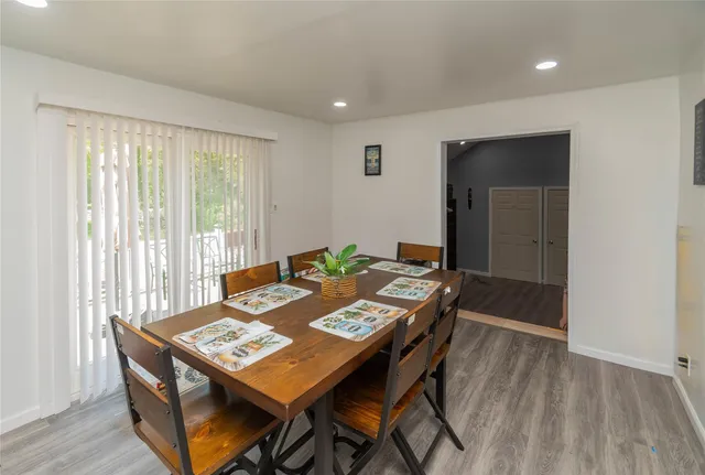 a kitchen with a sink cabinets and wooden floor